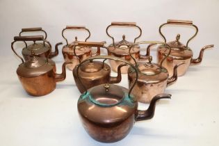 Eight Victorian copper kettles all with acorn & mushroom finials, H32cm (2)
