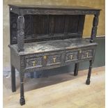 18th century and later oak dresser, raised back with four flower carved panels, above two drawers,