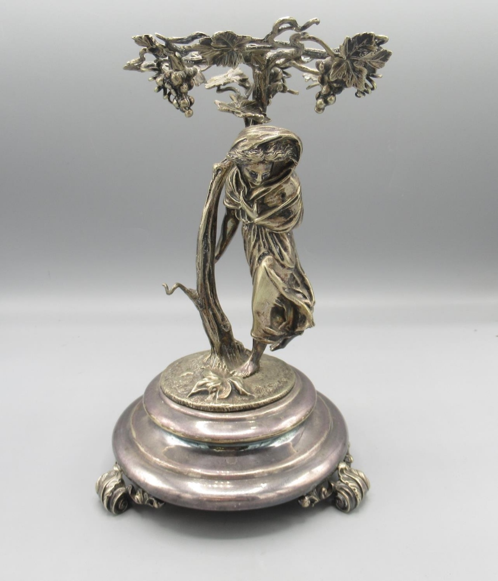 Early 20th century silver plated figural comport, modelled as a woman beneath a vine, lacking