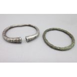 Ancient Persian silver bracelet with linear incised decoration (approx. 400BC), and another metal (