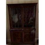 C19th mahogany side cabinet, lobed cornice above a pair of gothic moulded glazed doors, the base