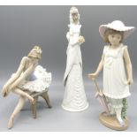 Lladro figure of a seated ballet dancer, H14.5cm; Nao figure of a girl with parasol; and a Lladro