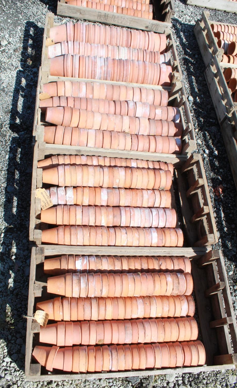 (Large quantity). Four crates of circa 1940s terracotta plant pots. Sizes 3 inch and 4 1/2 inch