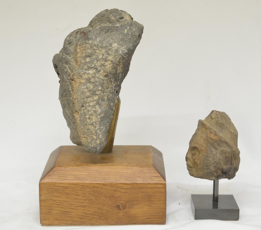 Two carved stone heads on wood and stone plinths, origins unknown, larger carving with plinth - Image 2 of 4