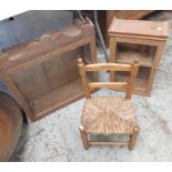 Glazed oak wall cupboard, similar glazed pine cupboard and a child's rush seat ladder back chair,