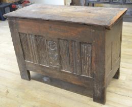 17th century oak coffer, hinged lid above linen fold and mask head panel front, W137cm D60cm