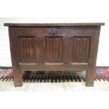 18th century oak coffer, hinged three panel lid and three linenfold panel front, W104cm D51cm