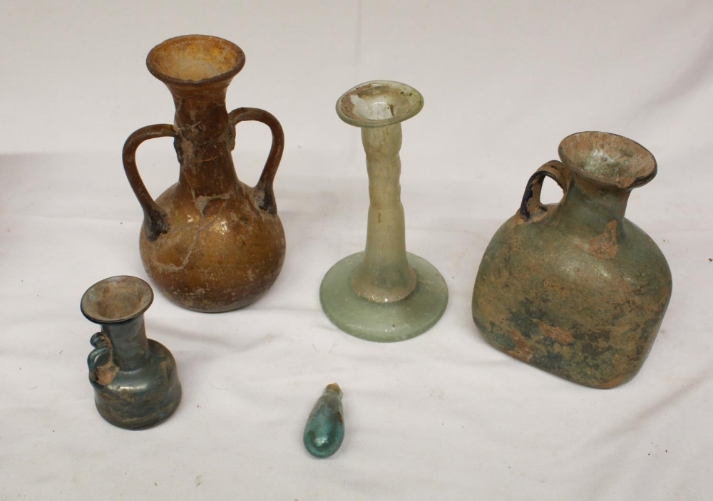 Collection of five glassware antiquities of various styles and periods, to include a candlestick,