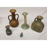 Collection of five glassware antiquities of various styles and periods, to include a candlestick,