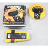 Two vintage hand held computer games, comprising Grandstand Munchman with box, and a CGL Galaxy