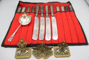 Three yellow metal enamelled place card holders, silver sugar sifter by Walker & Hall, Sheffield,