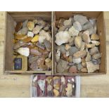 Collection of neolithic flint and stone hand tools including microliths and arrow heads, rocks