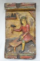 Circa 16th-18th century carved wood shop sign depicting St Crispin, patron saint of cobblers, one