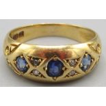 Victorian 18ct yellow gold ring set with three sapphires separated by smaller diamonds, stamped