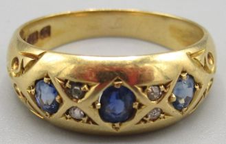 Victorian 18ct yellow gold ring set with three sapphires separated by smaller diamonds, stamped