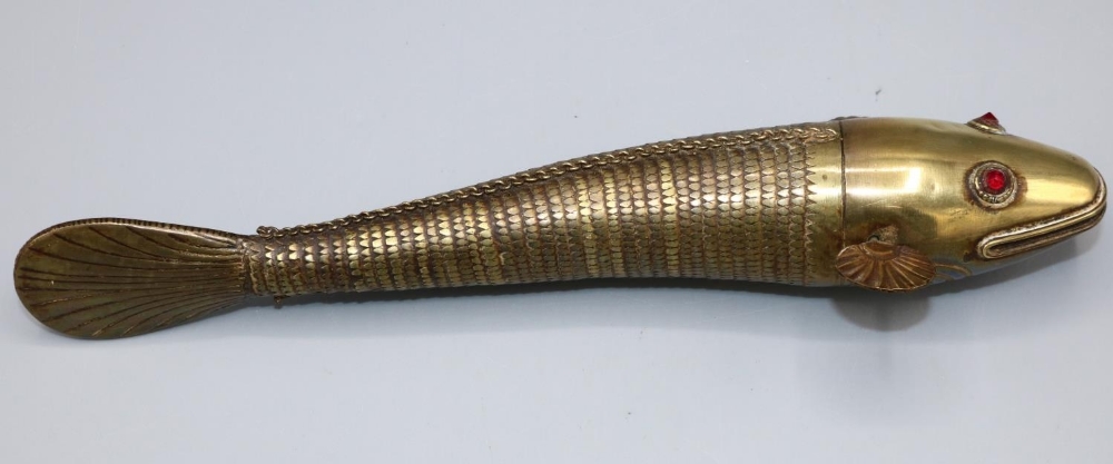 Early 20th century articulated brass Indian Medina style fish, red paste eyes, L23.5cm