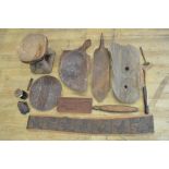 A large assortment of carved wooden souvenirs, mainly from the African continent. To include a large