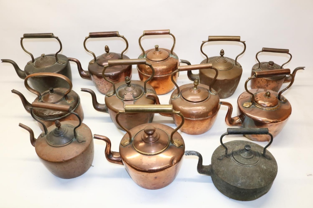 Twelve Victorian copper kettles all with acorn and mushroom finials, H30cm (2)