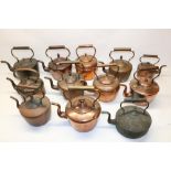 Twelve Victorian copper kettles all with acorn and mushroom finials, H30cm (2)