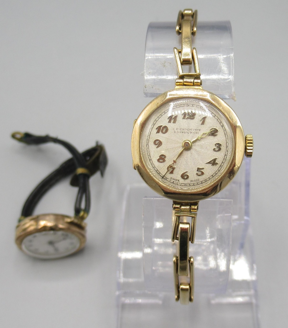 Ladies Texa 9ct gold wristwatch on rolled gold expanding bracelet, signed silvered engine turned