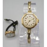 Ladies Texa 9ct gold wristwatch on rolled gold expanding bracelet, signed silvered engine turned