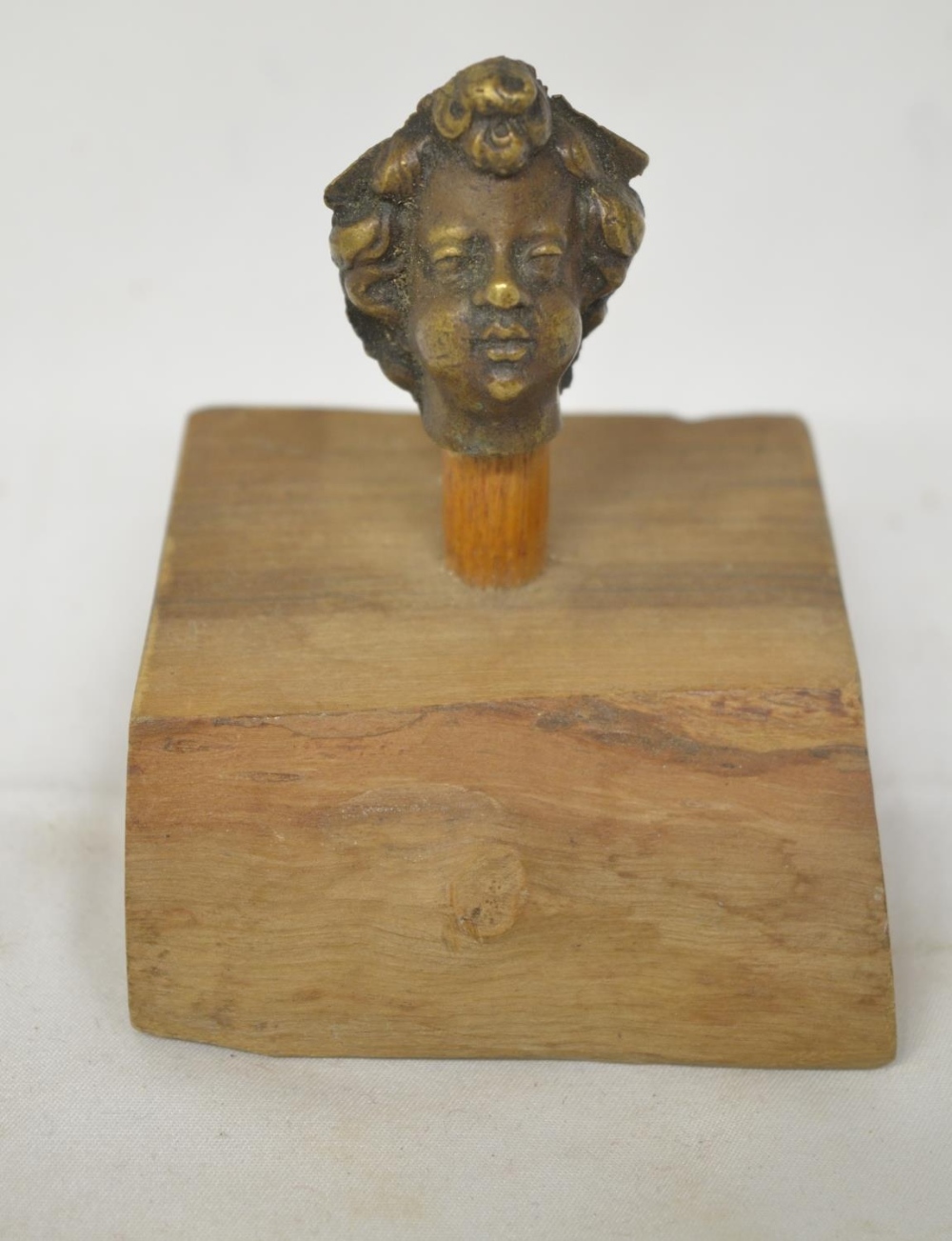 Small cast metal Romanesque head on wood plinth, overall H8cm (Victor Brox collection)