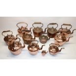 Twelve Victorian copper kettles all with acorn & mushroom finials, H30.5cm (2)