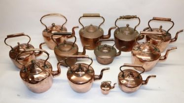 Twelve Victorian copper kettles all with acorn & mushroom finials, H30.5cm (2)