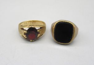 9ct yellow gold signet ring, the square face set with polished black stone, stamped 375, size N, and