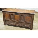 18th century oak coffer, hinged lid with incised line detail, panel front carved with lunettes,