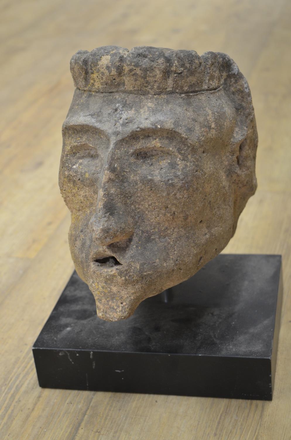 Collection of carved stoneware to include faces, a wolf head, one composite head on plinth, etc. ( - Image 7 of 8