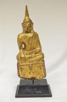 18/19th century wood carved Buddha on plinth with gilded finish with red seat, overall height