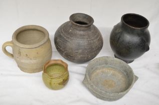Collection of four ceramic pots, glazed and unglazed, including both antique and modern examples,