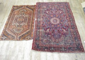 Persian red ground floral pattern rug, 212cm x 137cm and a small Caucasian rug with stepped