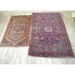 Persian red ground floral pattern rug, 212cm x 137cm and a small Caucasian rug with stepped