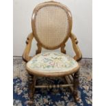 Victorian rocking chair, bergere back panel, circular seat with upholstered seat pad, H89cm