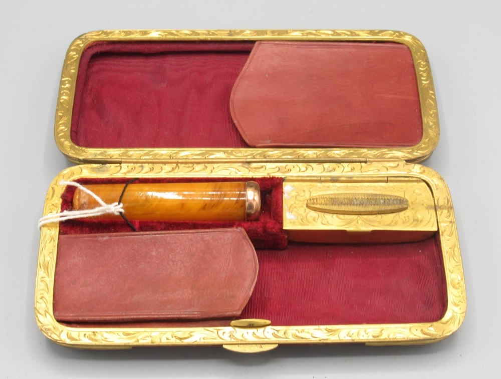 Leather and gilt metal cigar case with fitted interior, and a cheroot holder with yellow metal