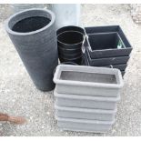 Collection of plastic planters of various styles