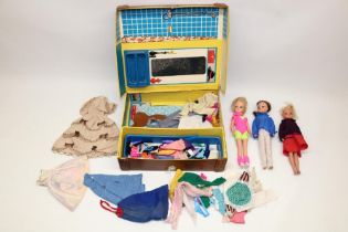 Suitcase containing three Sindy dolls and a quantity of clothing