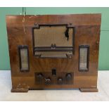 Circa 1920/30s art deco domestic radio in wooden casing. All Bakelite dials in good working order.