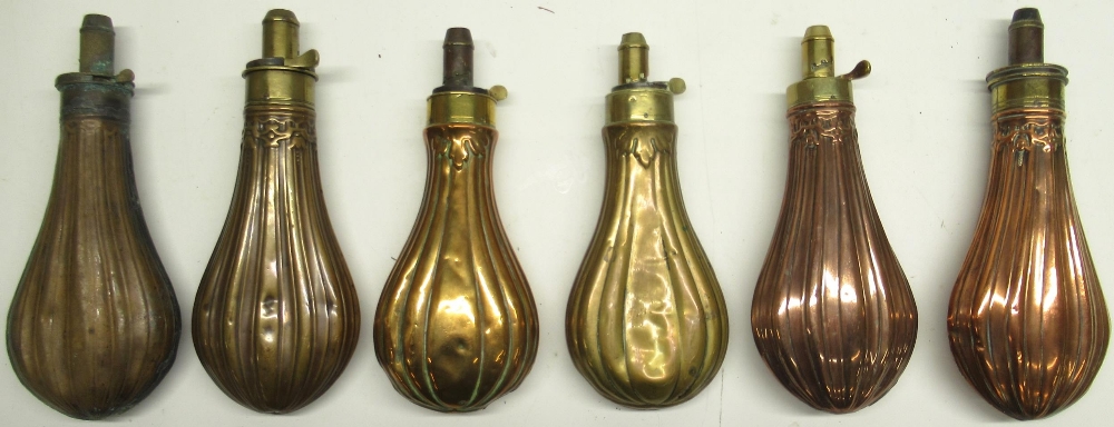 Patent 19th century copper and brass embossed powder flask, segmented design, 21cm and five similar