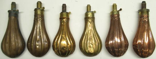 Patent 19th century copper and brass embossed powder flask, segmented design, 21cm and five similar