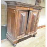 19th century Dutch oak walnut and rosewood cupboard, moulded cornice above two raised panel doors,