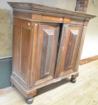 19th century Dutch oak walnut and rosewood cupboard, moulded cornice above two raised panel doors,