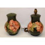 Pair of Moorcroft Pottery Hibiscus pattern table lamps, H25cm (2)