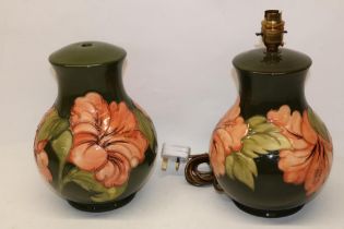 Pair of Moorcroft Pottery Hibiscus pattern table lamps, H25cm (2)