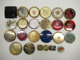 Twenty compacts from stratton, lancome, etc, handbag holder, and three pill boxes one with yellow