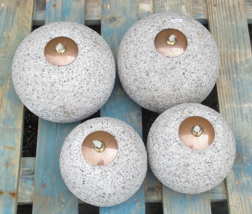 Four Portuguese granite outdoor oil burners