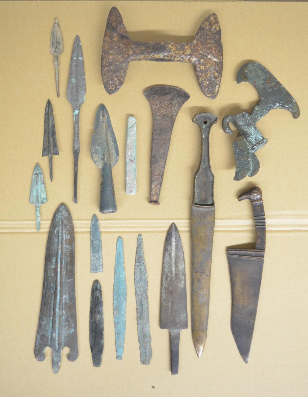 Collection of ancient Greek and Roman copper and bronze knives, spear and arrow heads, a double