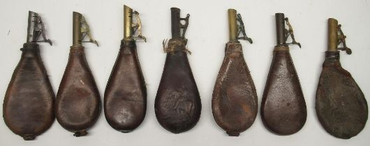19th century embossed leather shot flask and six other leather shot flasks